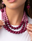 Collana girocollo multilinee con sfere in acrilico tono viola