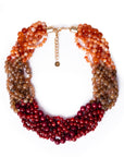 Collana girocollo a treccia con sfere in acrilico sui toni rossi ed arancio - Mya Accessories
