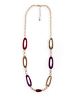 Collana lunga a catena con inserti ovali traforati in acrilico viola e rosso - Mya Accessories