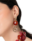 Orecchini pendenti con pietra circolare schiacciata in acrilico arancio e spirale - Mya Accessories