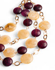 Collana a catena con cascata di pietre schiacciate in acrilico beige e viola - Mya Accessories