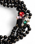 Collana girocollo multifilo con sfere in acrilico nere e fiore con pietre in vetro multicolore - Mya Accessories