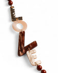 Collana lunga con sfere marroni ed inserti in acrilico con scritta love - Mya Accessories