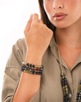 Bracciale elastico a quattro fili con pietre in acrilico tono verde e blu - Mya Accessories