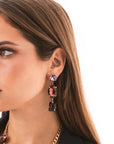Orecchini pendenti con pietre in vetro tono viola - Mya Accessories