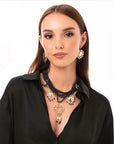 Collana multi fili con micro pietre in acrilico nere e cuori sacri pendenti - Mya Accessories