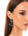 Orecchini in metallo pendenti a cuori smaltati a pois bianchi e neri - Mya Accessories