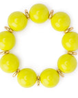 Bracciale elastico con sfere in acrilico verde lime, con rondelle in metallo - Mya Accessories
