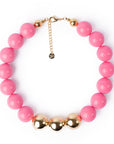 Collana girocollo in acrilico con sfere rosa di cui tre placcate in oro - Mya Accessories