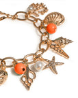 Bracciale a catena con pietre in vetro arancio e charms pendenti
