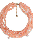 Collana multi filo con sfere in acrilico e vetro tono pesca - Mya Accessories