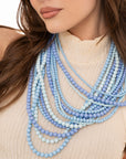 Collana multi linee con sfere in acrilico tono azzurro - Mya Accessories