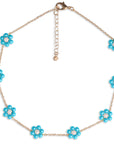 Collana girocollo a catena con fiori in acrilico perlati azzurri - Mya Accessories