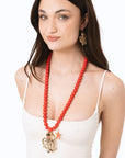 Collana lunga con sfere rosse in acrilico e pendente polipetto in metallo - Mya Accessories