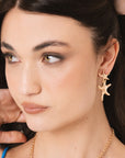 Orecchini pendenti in metallo con stelle marine - Mya Accessories