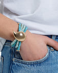 Bracciale elastico 4 fili con microcristalli blu e goccia in metallo - Mya Accessories