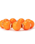 Bracciale elastico con sfere in acrilico arancio, con rondelle in metallo - Mya Accessories