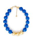 Collana girocollo in acrilico con sfere blu di cui tre placcate in oro - Mya Accessories