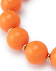 Collana girocollo in acrilico XXL arancio con rondelle in ottone - Mya Accessories