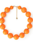 Collana girocollo in acrilico XXL arancio con rondelle in ottone - Mya Accessories
