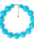 Collana girocollo in acrilico XXL azzurro con rondelle in ottone - Mya Accessories