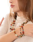 Bracciale elastico a tre linee con pietre in acrilico e vetro multi arancio - Mya Accessories