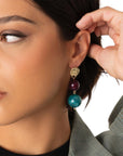 Orecchini pendenti con doppia sfera in acrilico magenta e verde petrolio - Mya Accessories