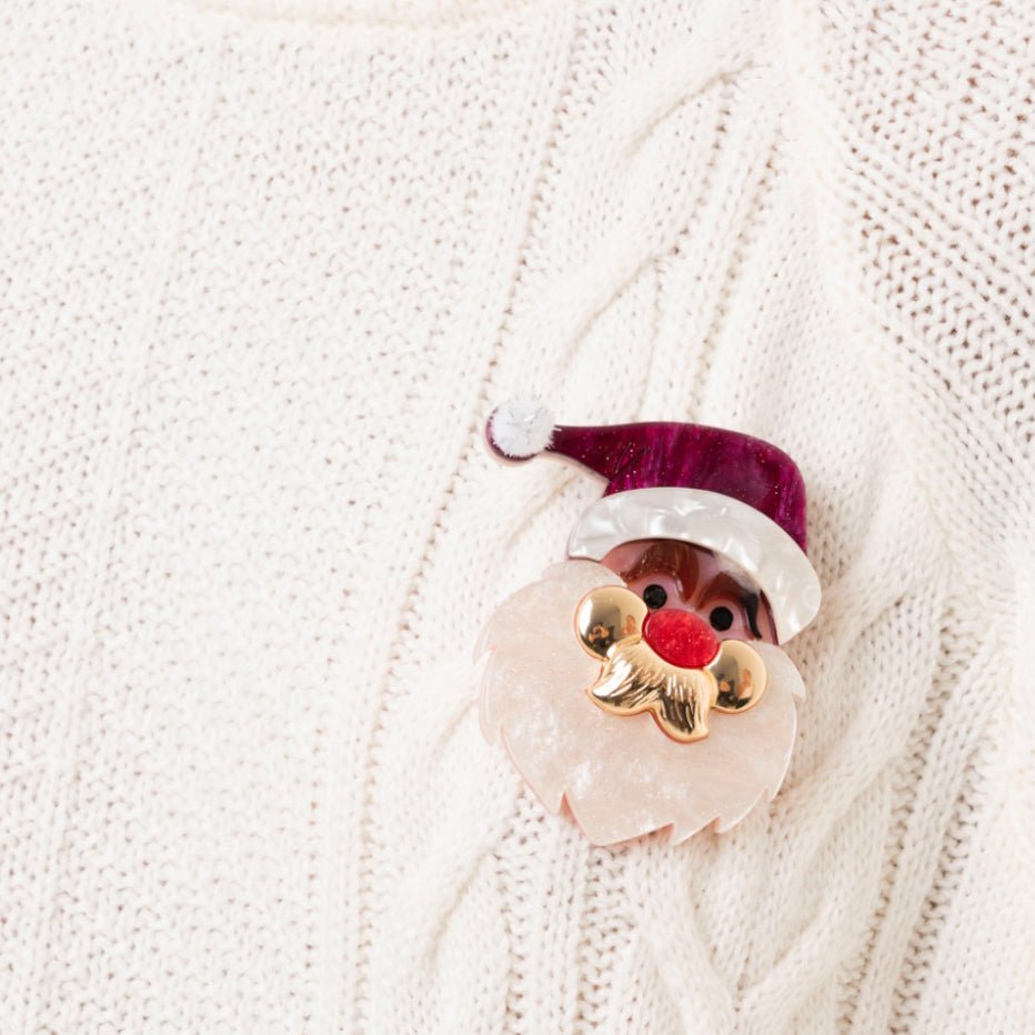 Spilla con base in metallo, design in acrilico del viso di babbo natale - Mya Accessories