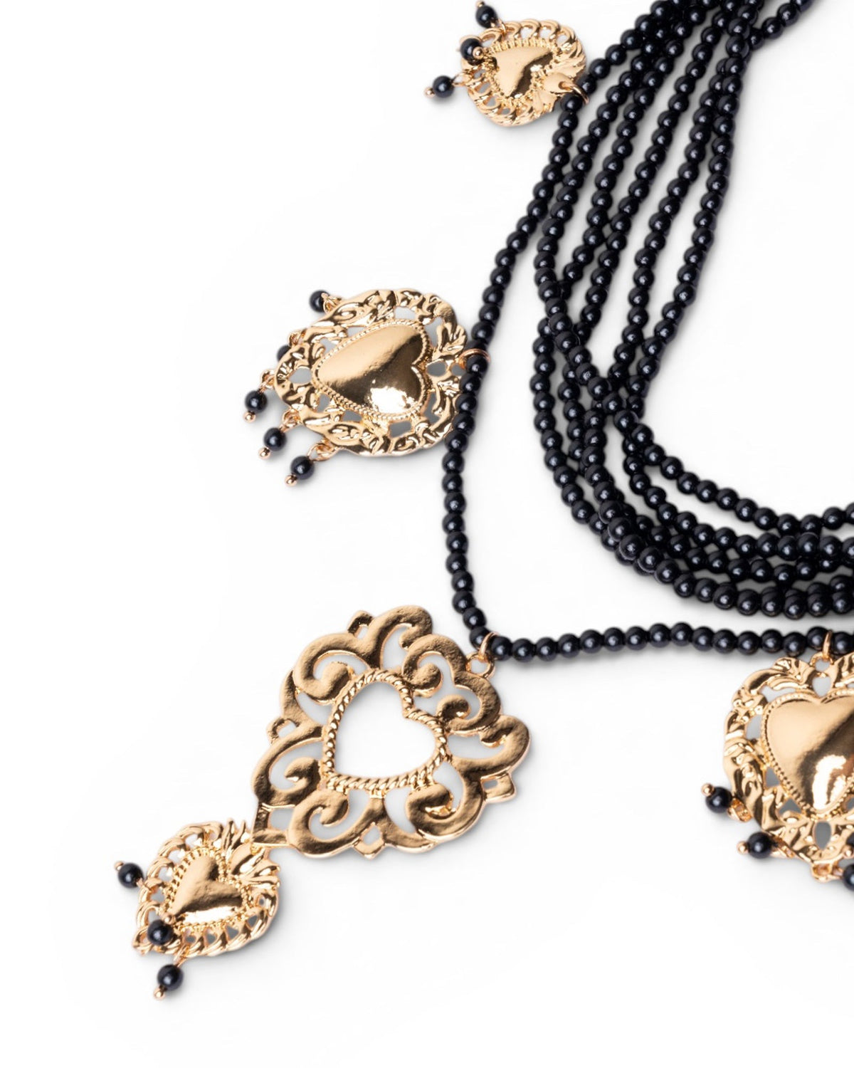 Collana multi fili con micro pietre in acrilico nere e cuori sacri pendenti - Mya Accessories