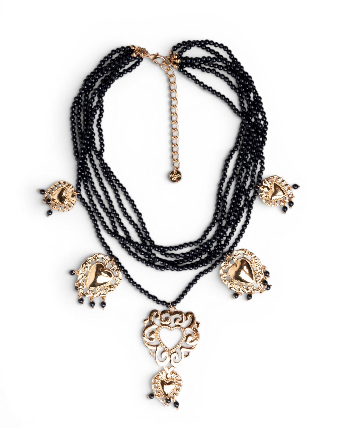 Collana multi fili con micro pietre in acrilico nere e cuori sacri pendenti - Mya Accessories