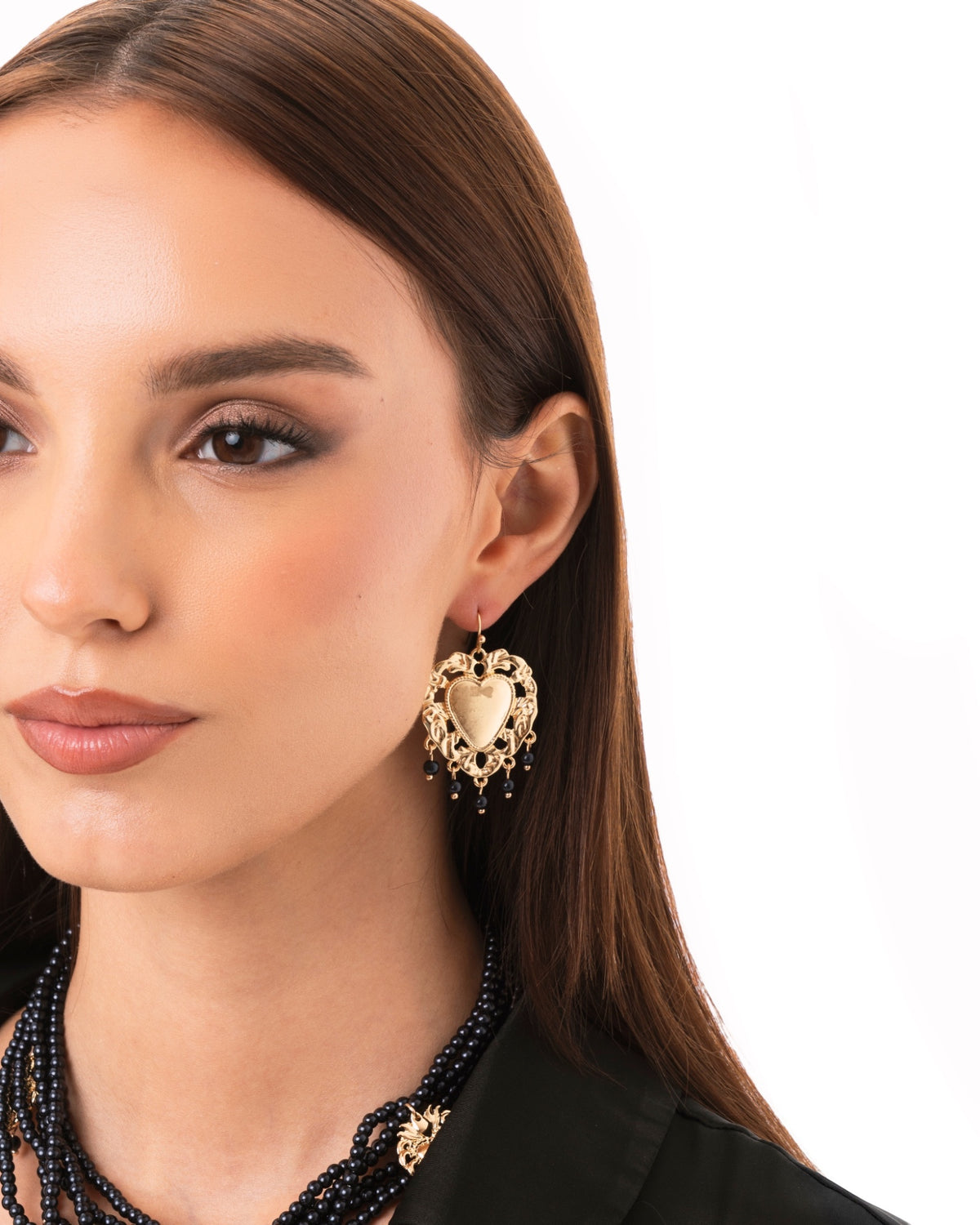 Orecchini pendenti con cuore sacro in metallo e perline in acrilico nere - Mya Accessories