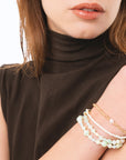Bracciale elastico multi filo con pietre in vetro e conchiglie tono verde - Mya Accessories