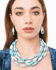 Collana girocollo multi fili con elementi ovali in acrilico turchese - Mya Accessories