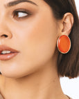 Orecchini a clip ovale in metallo con pietra in resina arancio - Mya Accessories