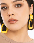 Orecchini pendenti a clip geometrici in acrilico giallo - Mya Accessories