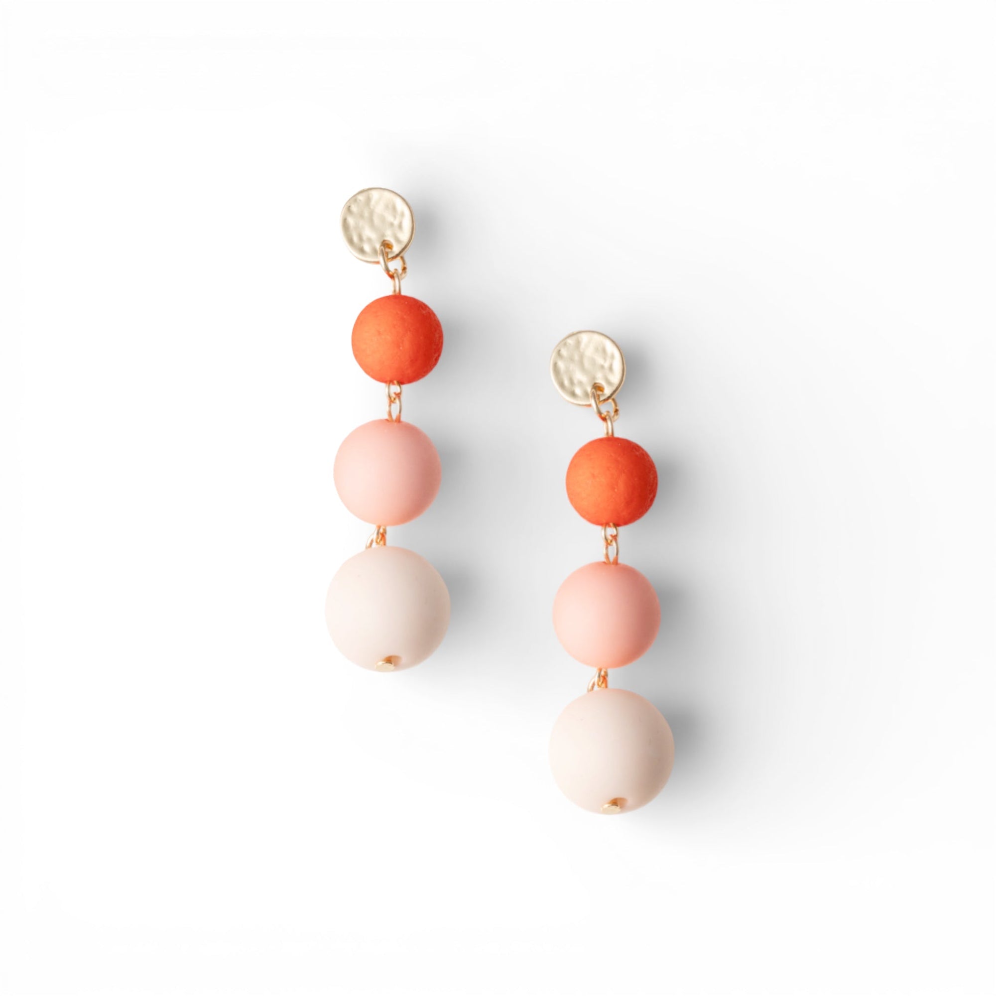 Orecchini pendenti a tre sfere in acrilico tono arancio opaco - Mya Accessories