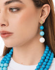 Orecchini pendenti a tre sfere in acrilico tono azzurro opaco - Mya Accessories