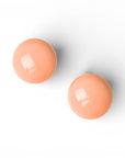 Orecchini a clip con pietra circolare in resina color pesca - Mya Accessories