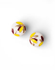 Orecchini circolari smaltati di bianco con designa fiori multi - Mya Accessories