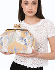 Borsa clutch morbida con motivo floreale arancio e celeste - Mya Accessories
