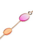 Collana lunga in metallo con inserti circolari in acrilico trasparente fucsia ed arancio - Mya Accessories