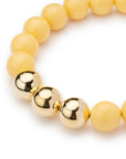Collana girocollo in acrilico con sfere gialle di cui tre placcate in oro - Mya Accessories